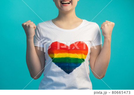 gay pride lgbtqia celebration woman rainbow flag gay pride lgbtqia celebration woman rainbow flag 80665473