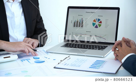 Business concept a male startup entrepreneur presenting business data in dashboard to an investor for the business expansion. Business concept a male startup entrepreneur presenting business data in dashboard to an investor for the business expansion. 80666523