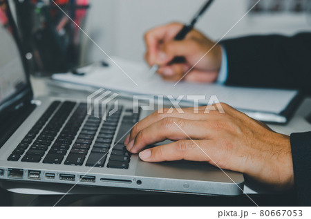 close up hand typing on computer laptop keyboard 80667053