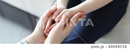 Palms of mother and girl are joined together 80668538