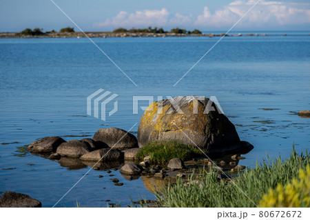 An ocean boulder in beautiful sunset light 80672672