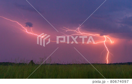 Lightning with with beautiful purple morning light Lightning with with beautiful purple morning light 80674097