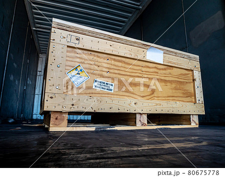 Radiation label beside the transport wooden box Type A package 80675778