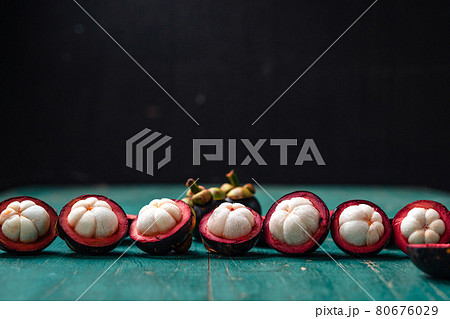 Mangosteen fruit on light blue wooden background 80676029