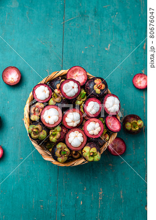 Mangosteen fruit on light blue wooden background 80676047