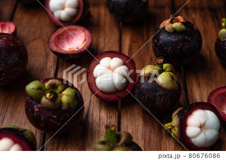 Mangosteen fruit on wooden background 80676086