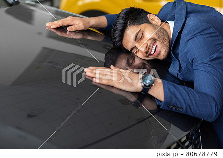 Delighted arab man hugging car of his dream 80678779
