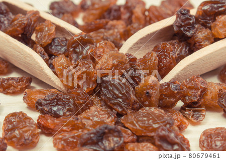 Fresh healthy raisins containing vitamins and minerals. Nutritious eating Fresh healthy raisins containing vitamins and minerals. Nutritious eating 80679461