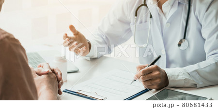 Doctor is explaining the treatment about the possible treatment of patients in the future. 80681433