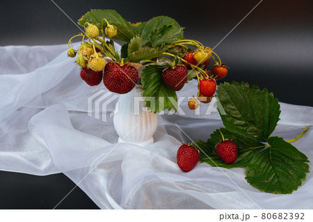 Food dark photography Strawberries on the white scarf and dramatic dark background. 80682392
