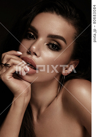 Beautiful girl with bright fashionable make-up and unusual gold accessories. Beauty face. 80683084