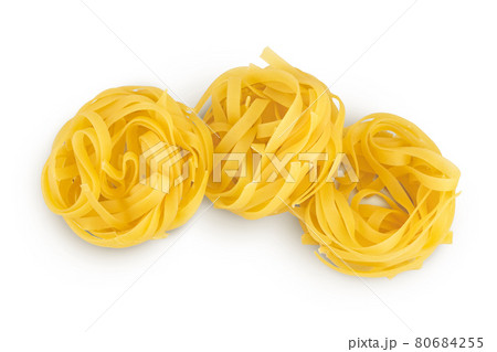 Raw tagliatelle pasta isolated on white background with clipping path and full depth of field. Top view. Flat lay 80684255
