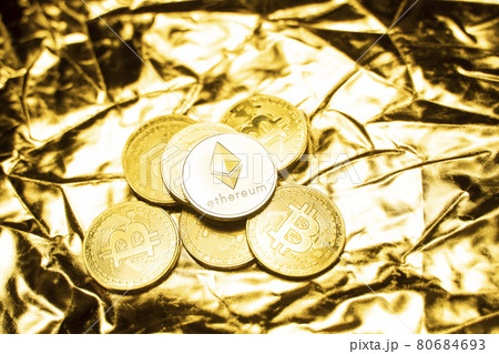 Gold ethereum coins on a golden background. Trading on the cryptocurrency exchange. Cryptocurrency Stock Market Concept. Virtual money concept. Mining or blockchain technology. Business concept. 80684693
