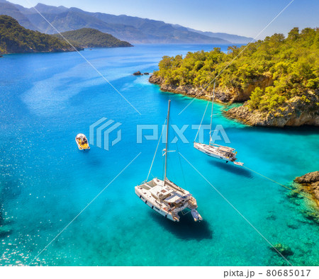 Aerial view of beautiful yachts and boats on the sea at sunset 80685017