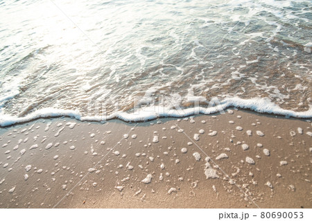 Close Up Wave Sand Beach Sea Foam. Closeup of sea wave with foam on beach sand. Vacation Summer background Close Up Wave Sand Beach Sea Foam. Closeup of sea wave with foam on beach sand. Vacation Summer background 80690053