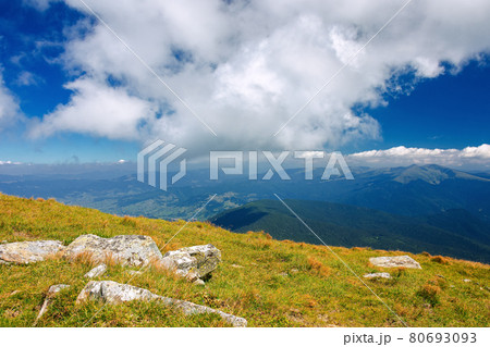 mountain landscape on a sunny day. beautiful nature background. gorgeous cloudscape above the mountain ridge with grassy meadows. travel back country concept 80693093