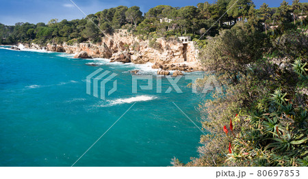 Cap d`Antibes on the French riviera. Turquoise blue mediterranean sea and cliffs. 80697853