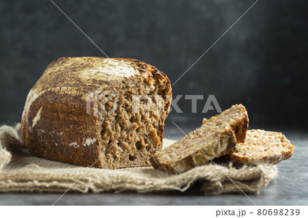 Square artisan sourdough rye bread on dark background. /wild yeast, rustic, artisan loaf. 80698239