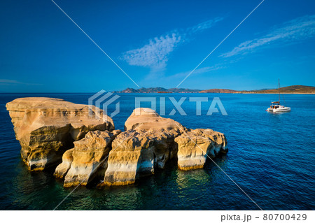 Yacht boat at Sarakiniko Beach in Aegean sea, Milos island , Greece 80700429