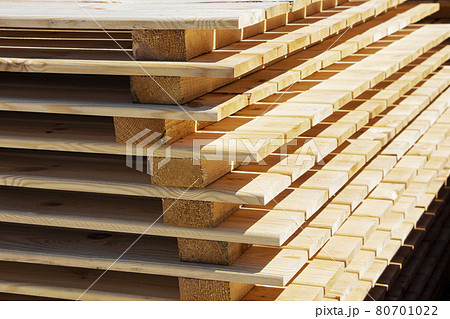 Wooden planks. Stack of wood for air drying. Air drying of wood Wooden planks. Stack of wood for air drying. Air drying of wood 80701022