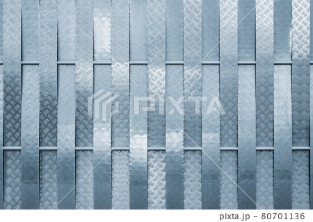 Close up of the silver colored metal fence background. 80701136