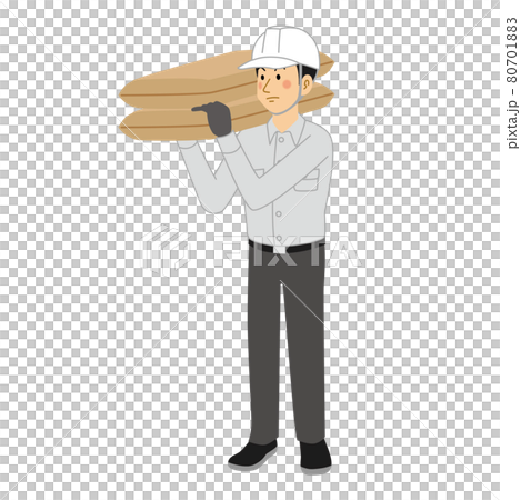 A man at a construction site carrying a sandbag 80701883