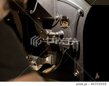 Modern coffee roasting machine with various metal parts Modern coffee roasting machine with various metal parts 80703049