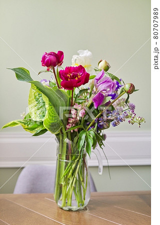 Bouquet of bright flowers on the table in jug Bouquet of bright flowers on the table in jug 80707989