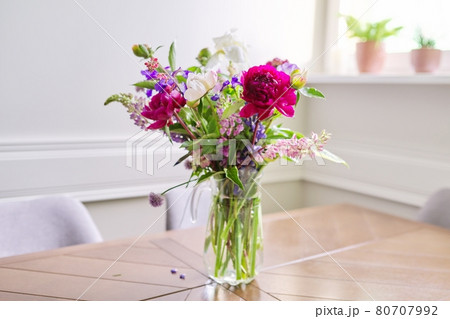 Bouquet of bright flowers on the table in jug 80707992