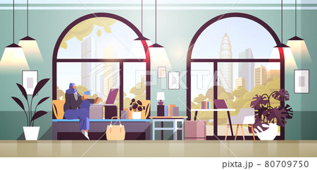 arab woman with credit card using laptop online shopping concept living room interior arab woman with credit card using laptop online shopping concept living room interior 80709750