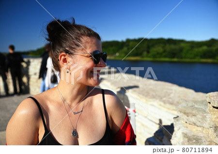 Portrait of woman against the background of old ruins 80711894