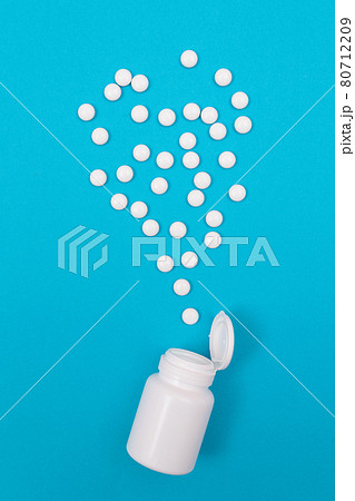 Pharmaceutical Industry and Medicinal Products - White Pills on Blue Background 80712209