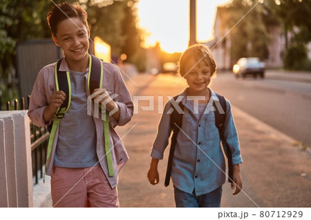 School boys running to school. School boys having fun after school. School boys running to school. School boys having fun after school. 80712929