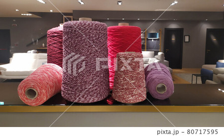 Roll of wool fiber threads, colors analogous to magenta 80717595