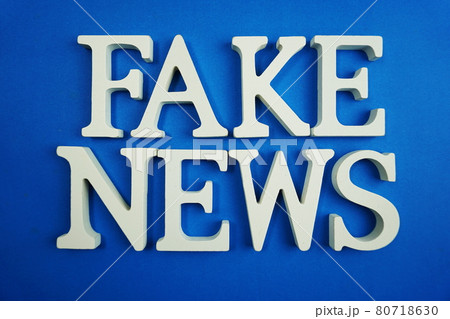 Fake News word alphabet letters on blue background 80718630