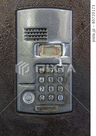 Dirty Intercom at the door of an apartment building. 80720173