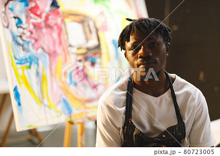 Portrait of african american male painter at work looking at camera in art studio 80723005