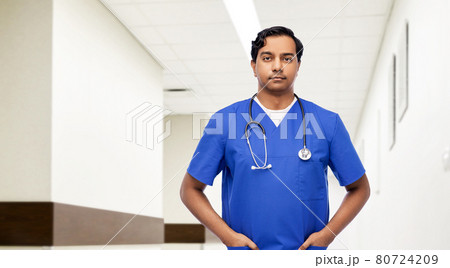 indian doctor or male nurse with stethoscope indian doctor or male nurse with stethoscope 80724209