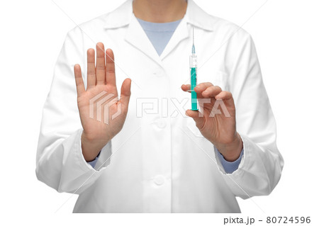 close up of doctor with syringe shows stop gesture close up of doctor with syringe shows stop gesture 80724596