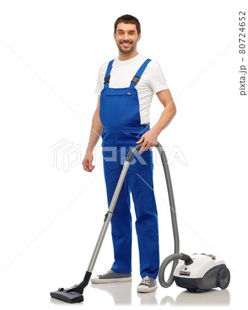 male worker cleaning floor with vacuum cleaner 80724652