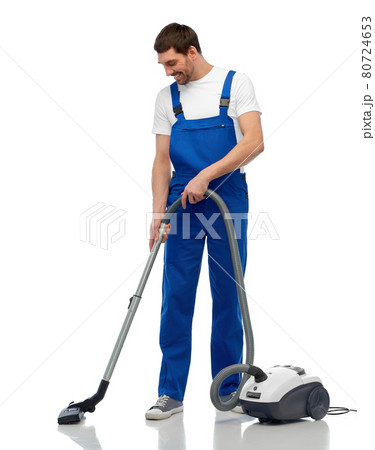 male worker cleaning floor with vacuum cleaner male worker cleaning floor with vacuum cleaner 80724653