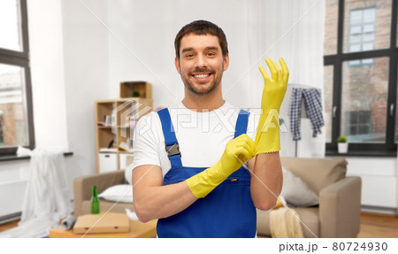 male worker or cleaner wearing gloves at home 80724930