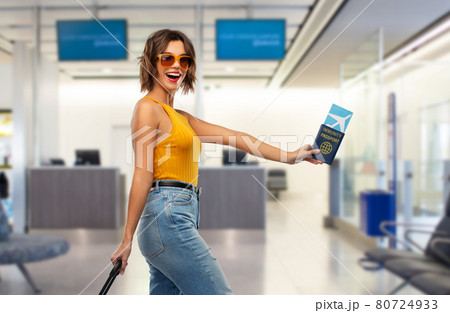 happy woman with air ticket and immunity passport happy woman with air ticket and immunity passport 80724933