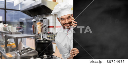 happy smiling male chef with big black chalkboard happy smiling male chef with big black chalkboard 80724935