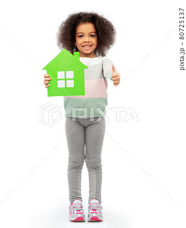smiling african girl holding green house icon smiling african girl holding green house icon 80725137