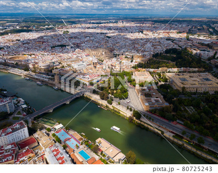 Aerial view Sevilla of city center with embankment of Guadalquivir. 80725243