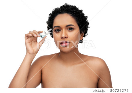 young african american woman with eye drops young african american woman with eye drops 80725275