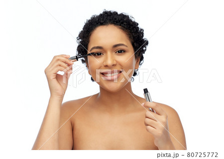 beautiful african american woman applying mascara beautiful african american woman applying mascara 80725772