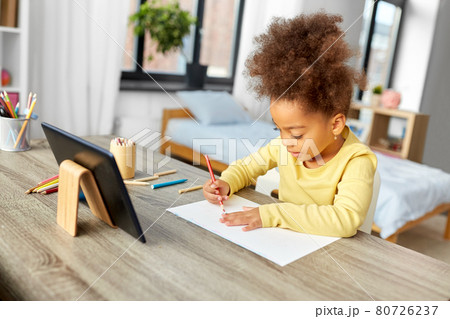 little girl drawing with coloring pencils at home little girl drawing with coloring pencils at home 80726237