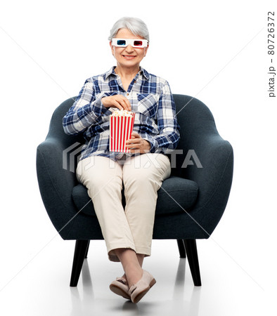 old woman in 3d glasses with popcorn watches movie old woman in 3d glasses with popcorn watches movie 80726372